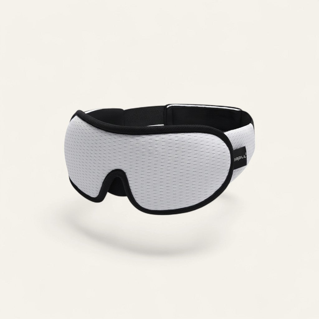 Driftward 3D contoured white mesh sleep mask with adjustable strap and molded cups for complete darkness.