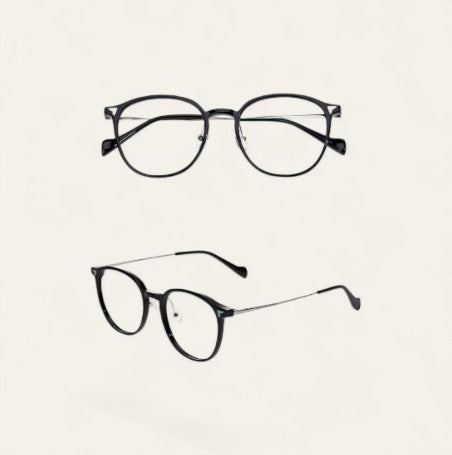 Driftward ultra light blue light blocking glasses with a black TR90 frame and silver temples. Round lenses.