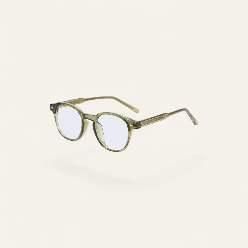 Driftward blue light blocking glasses with a translucent olive TR90 frame and clear lenses.