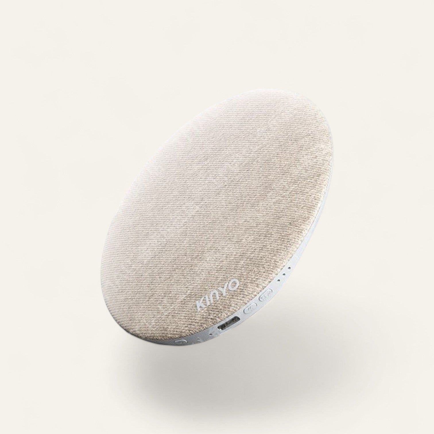 Driftward premium Bluetooth pillow speaker with stereo sound and fabric finish, resting on a rock in water.