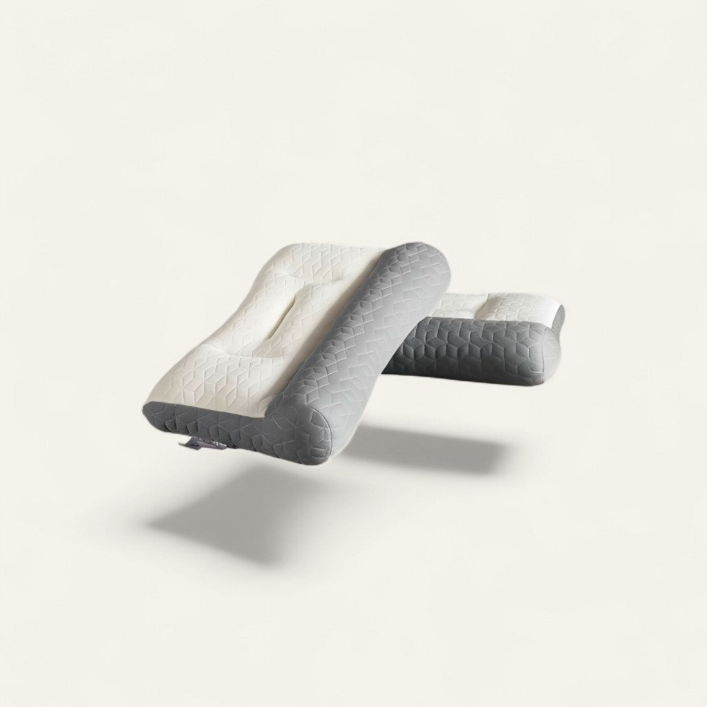 Driftward ergonomic latex cervical support pillow in white and grey with a geometric pattern. Designed for neck pain relief.