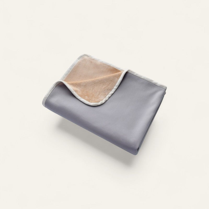 Driftward grey ice silk cooling blanket with a soft tan plush lining. Lightweight and machine washable.
